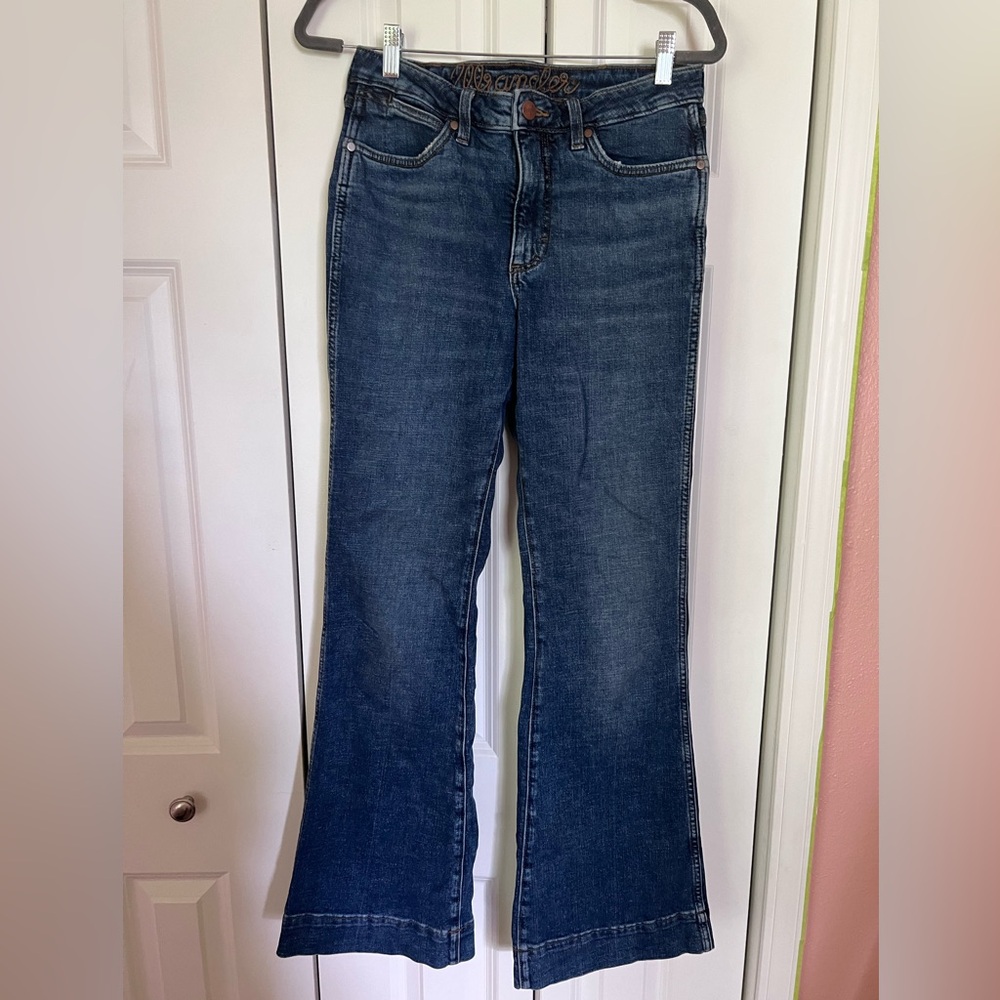 Two pairs of women’s Wranglers jeans. Size 28 waist x 34 length.